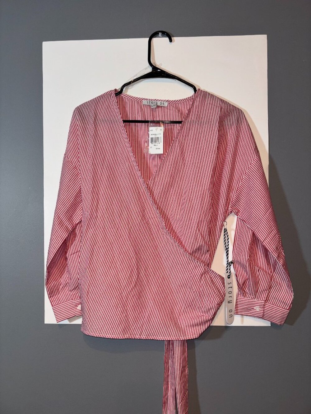 Story On red and white striped wrap blouse